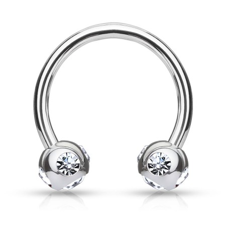 Podkówka z białymi kryształkami umieszczonymi pod i po bokach kuleczek. Wykonana ze stali chirurgicznej 316L. Idealna do septum, daith i smiley. Gwint zewnętrzny.