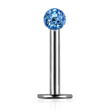 Labret Blue Ferido z niebieskim syntetycznym kamieniem i gładką kulką pokrytą żywicą epoksydową. Idealny do lobe, helix, tragus, conch oraz piercingu wargi. Wykonany ze stali chirurgicznej 316L, gwint zewnętrzny.