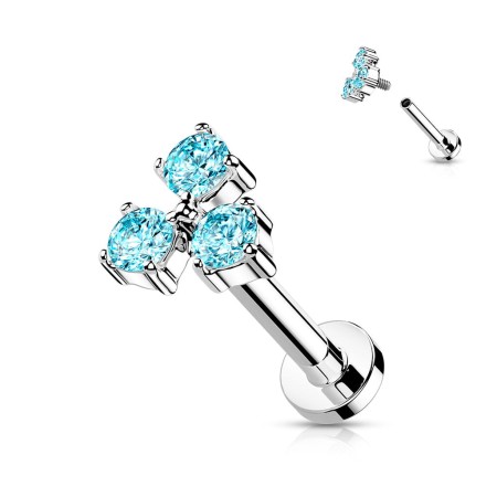 Labret Trinity z trzema niebieskimi cyrkoniami CZ, doskonały do piercingu lobe, tragus, helix, conch oraz medusa. Bezpieczny gwint wewnętrzny. Wykonany ze stali chirurgicznej 316L, nakrętka mosiężna, rozmiar 5 mm.