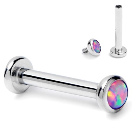 Tytanowy labret z fioletowym opalem, z gwintem wewnętrznym i powłoką PVD. Nakrętka dostępna w rozmiarach 3 mm lub 4 mm. Idealny na świeże przekłucia i dla alergików na nikiel. Pasuje do helix, lobe, conch oraz piercingu wargi.