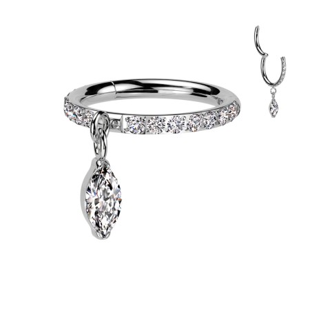 Tytanowy clicker z kryształową obręczą i wiszącą łezką — trwały, lekki i bezpieczny dla wrażliwej skóry. Elegancka obręcz z kryształów i subtelna łezka dodają blasku. Dostępny w średnicach 8 mm i 10 mm, idealny do conch i helix.