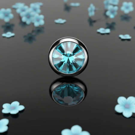 Tytanowy dysk do microdermala z niebieską cyrkonią łączy elegancję i subtelny blask.