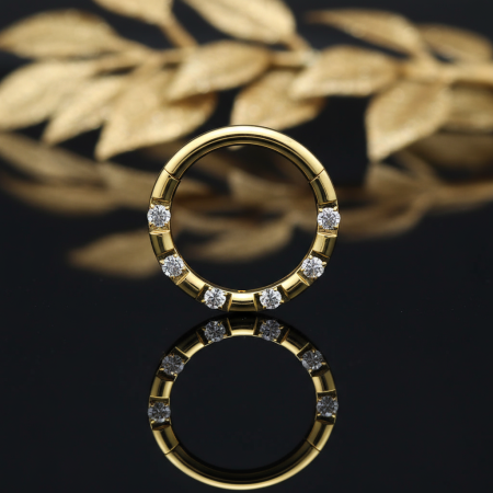 Złoty Clicker z 7 cyrkoniami CNC — elegancki i precyzyjny.