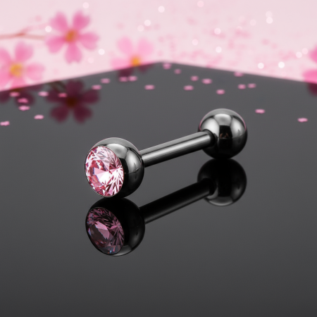Czarny kolczyk do języka z różową cyrkonią.
