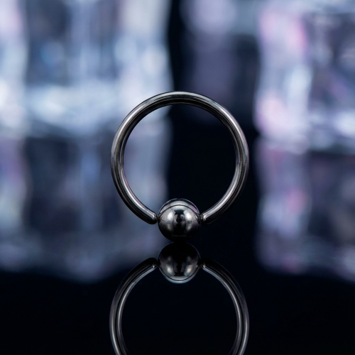 Przejdź do produktu Rozginane czarne kółeczko do nosa z kuleczką 