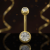 Tytanowy kolczyk do pępka gold zircon