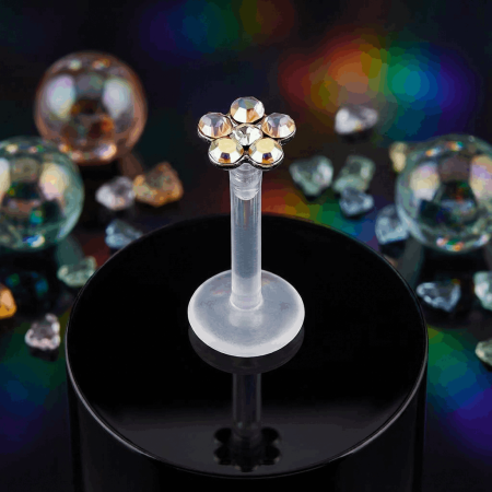 Przezroczysty labret z bioflexu z opalizującym kwiatkiem Aurora Borealis.