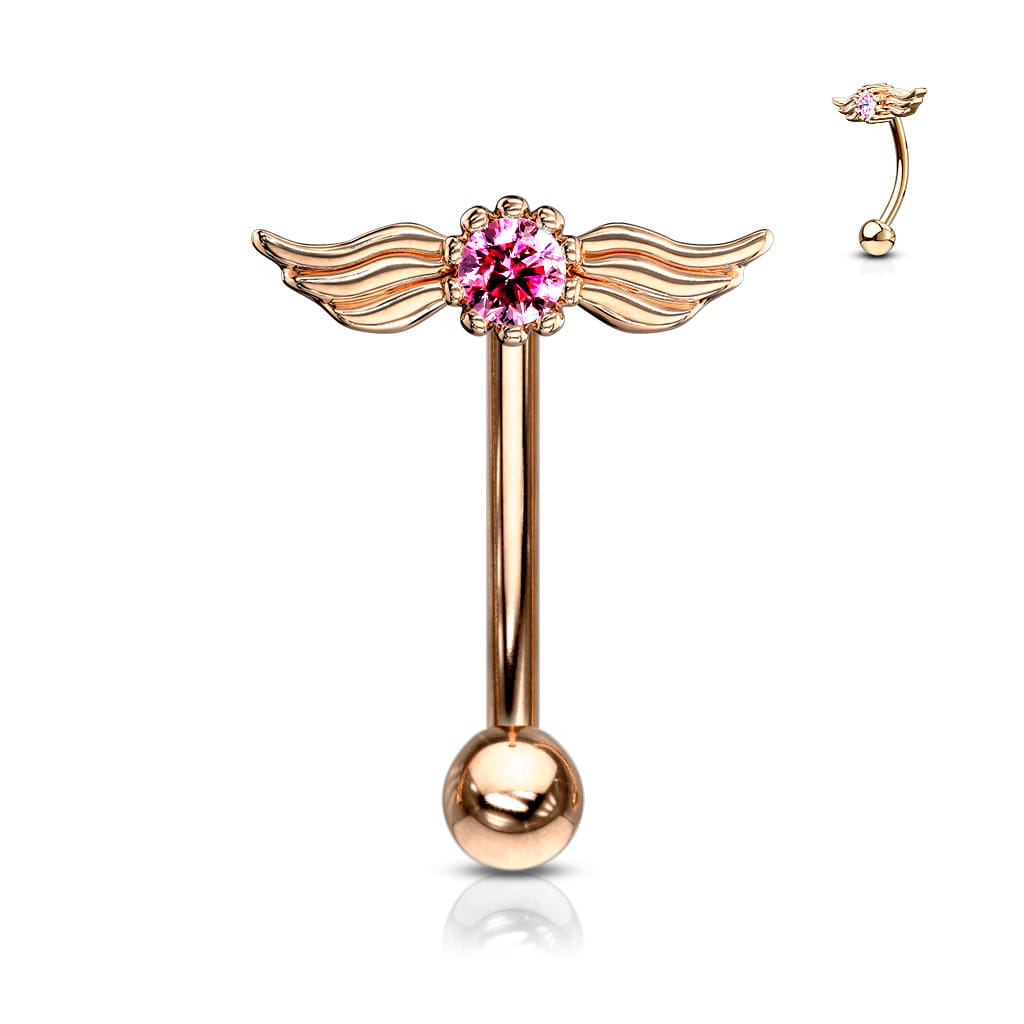 Banan rose gold z ozdobą w postaci skrzydełek i różową cyrkonią między nimi. Wykonany ze stali chirurgicznej 316L i mosiądzu. Typ gwintu: zewnętrzny.