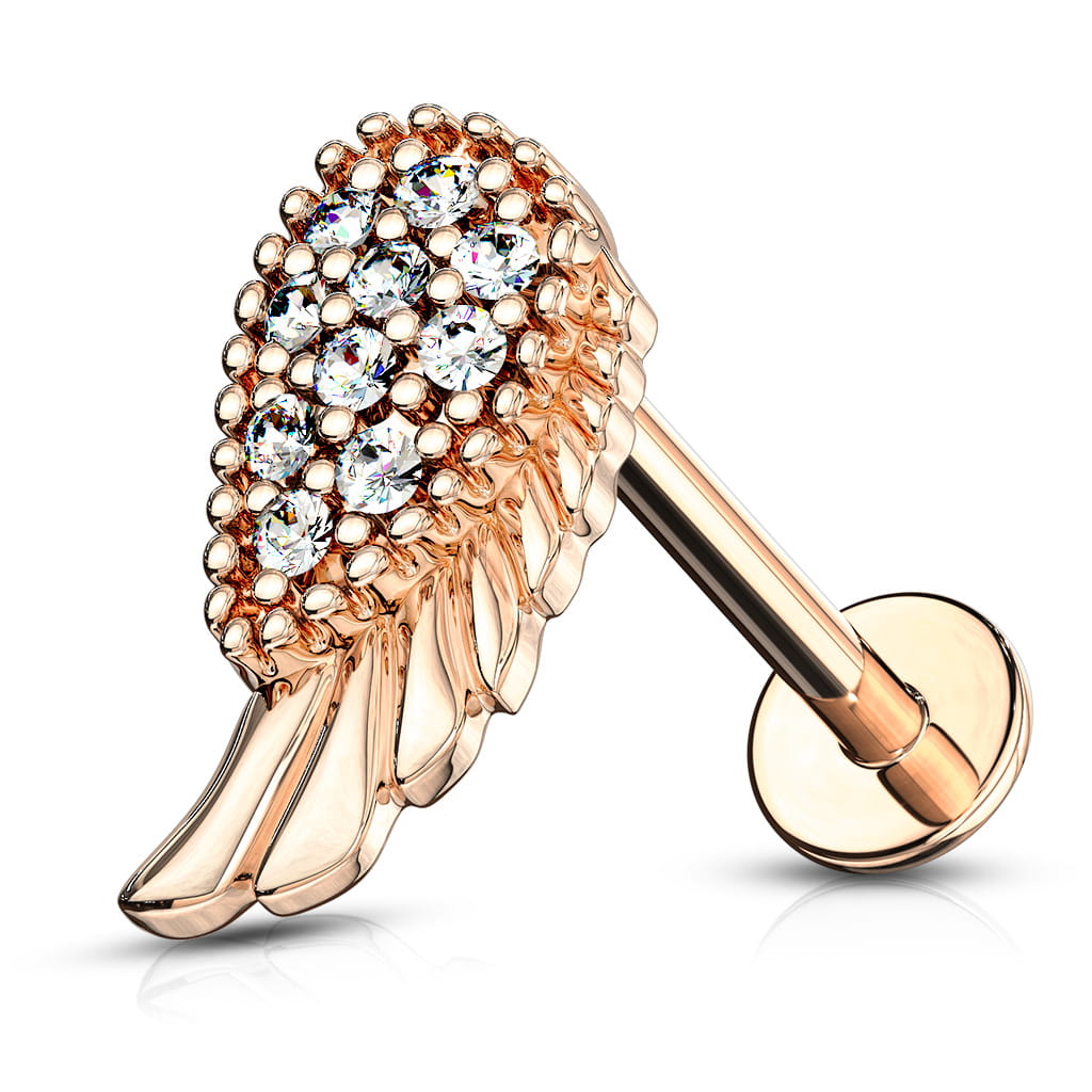 Labret skrzydło anioła w różowym złocie z białymi kryształkami. Nakrętka na gwint wewnętrzny. Idealny do piercingu lobe, helix, tragus, conch. Pręt ze stali chirurgicznej 316L, nakrętka z mosiądzu pokryta 14K złotem.