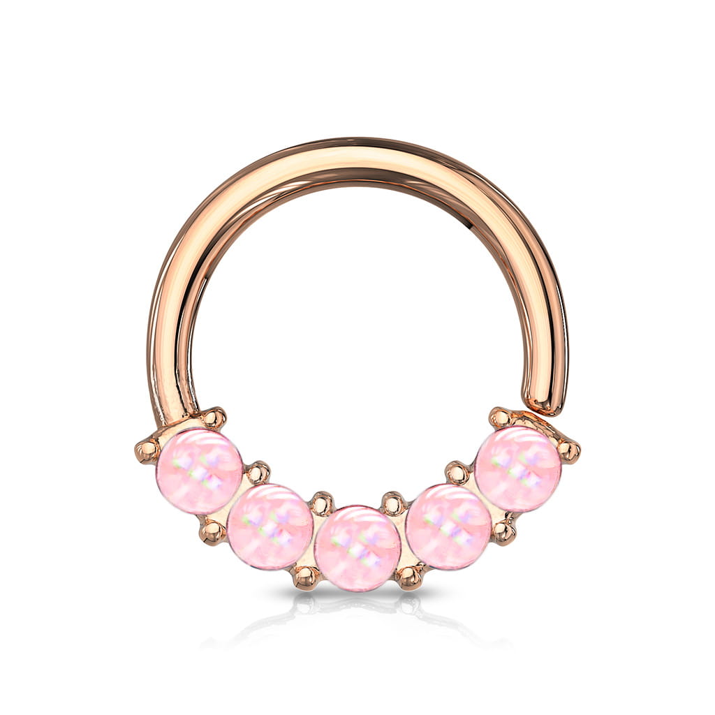 Kółeczko do ucha w kolorze różowego złota z 5 różowymi kamieniami rozświetlającymi. Wykonany ze stali chirurgicznej 316L z powłoką PVD. Idealne do septum, smiley i daith. Łatwe do założenia – rozginane i zaginane w przekłuciu.