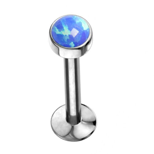 Tytanowy labret z niebieskim opalem, gwint wewnętrzny, wykonany z tytanu G23. Nakrętka 3 lub 4 mm. Idealny na świeże przekłucia i dla alergików. Pasuje do helix, lobe, conch oraz piercingu wargi.