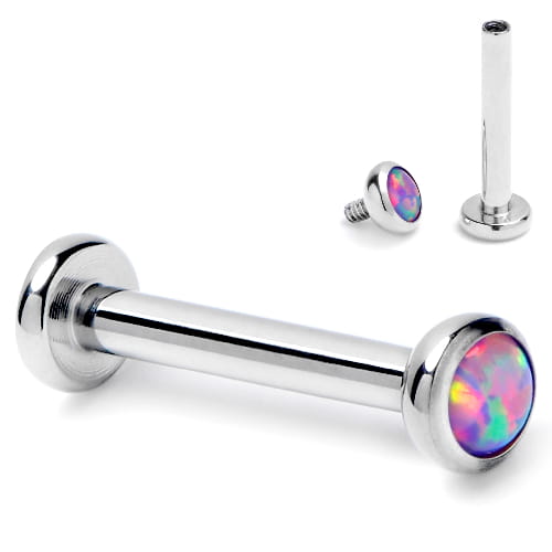 Tytanowy labret z fioletowym opalem, z gwintem wewnętrznym i powłoką PVD. Nakrętka dostępna w rozmiarach 3 mm lub 4 mm. Idealny na świeże przekłucia i dla alergików na nikiel. Pasuje do helix, lobe, conch oraz piercingu wargi.