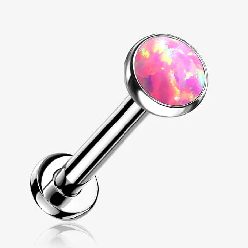 Tytanowy labret z różowym opalem, nakrętka jest płaska idealnie przylegająca, co zmniejsza ryzyko zahaczenia